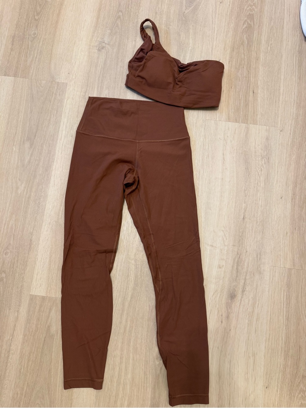 Lululemon High-Rise Ribbed Leggings in Brown and One shoulder sports bra set
